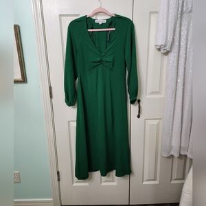 Green midi dress with ruched V-neck and long bishop sleeves for wedding guest